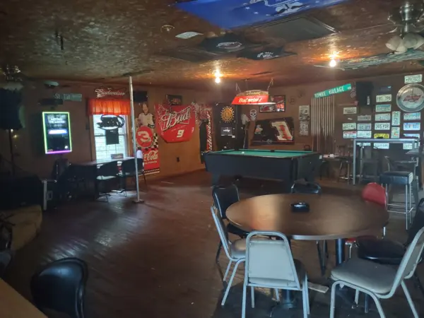 Inside Loggers Inn Saloon: pool table, jukebox and dart boards