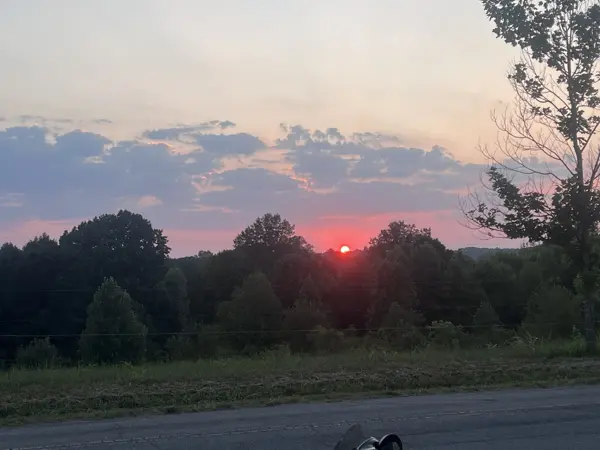 Red sunset over the trees seen from Loggers Inn, Santa Fe TN